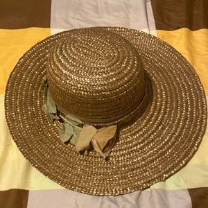 Brown hat with rose along the side